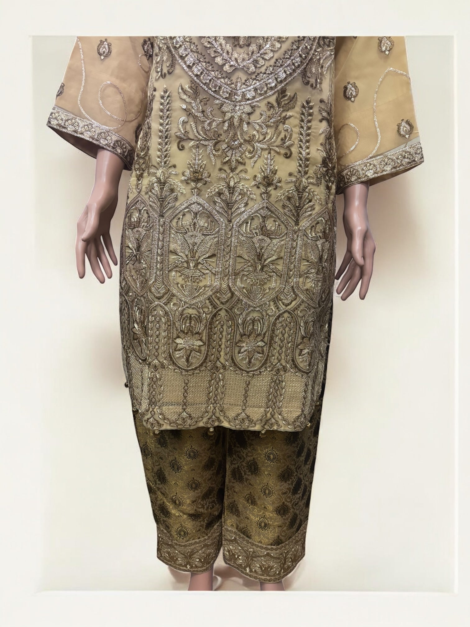 Traditional Salwar Kameez set by Saree Ghor Charlotte, ethnic women’s cultural wear with intricate patterns and vibrant colors.