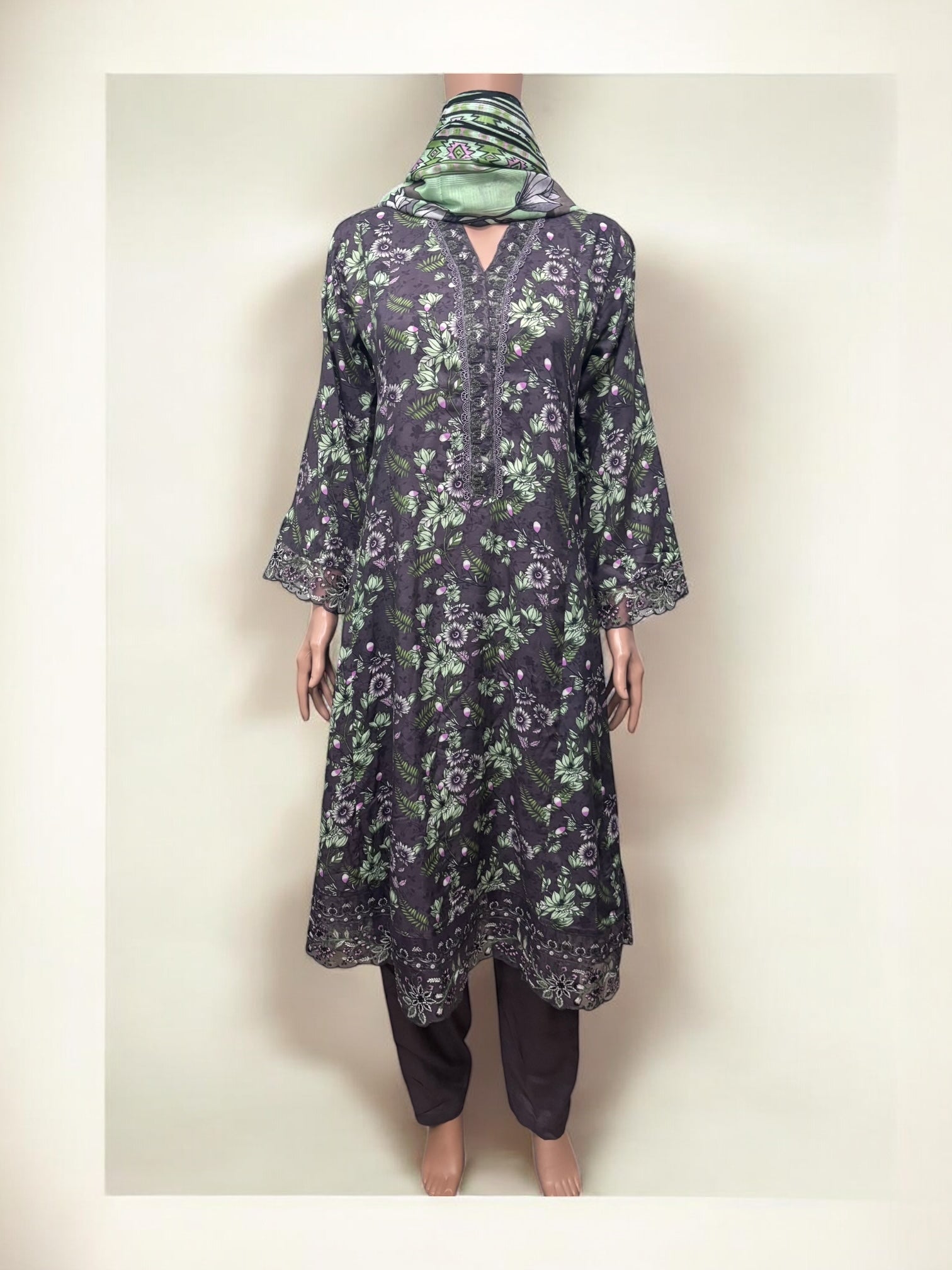 Traditional Saree Ghor Charlotte Salwar Kameez set for women, showcasing ethnic wear with intricate fabric and vibrant design details.