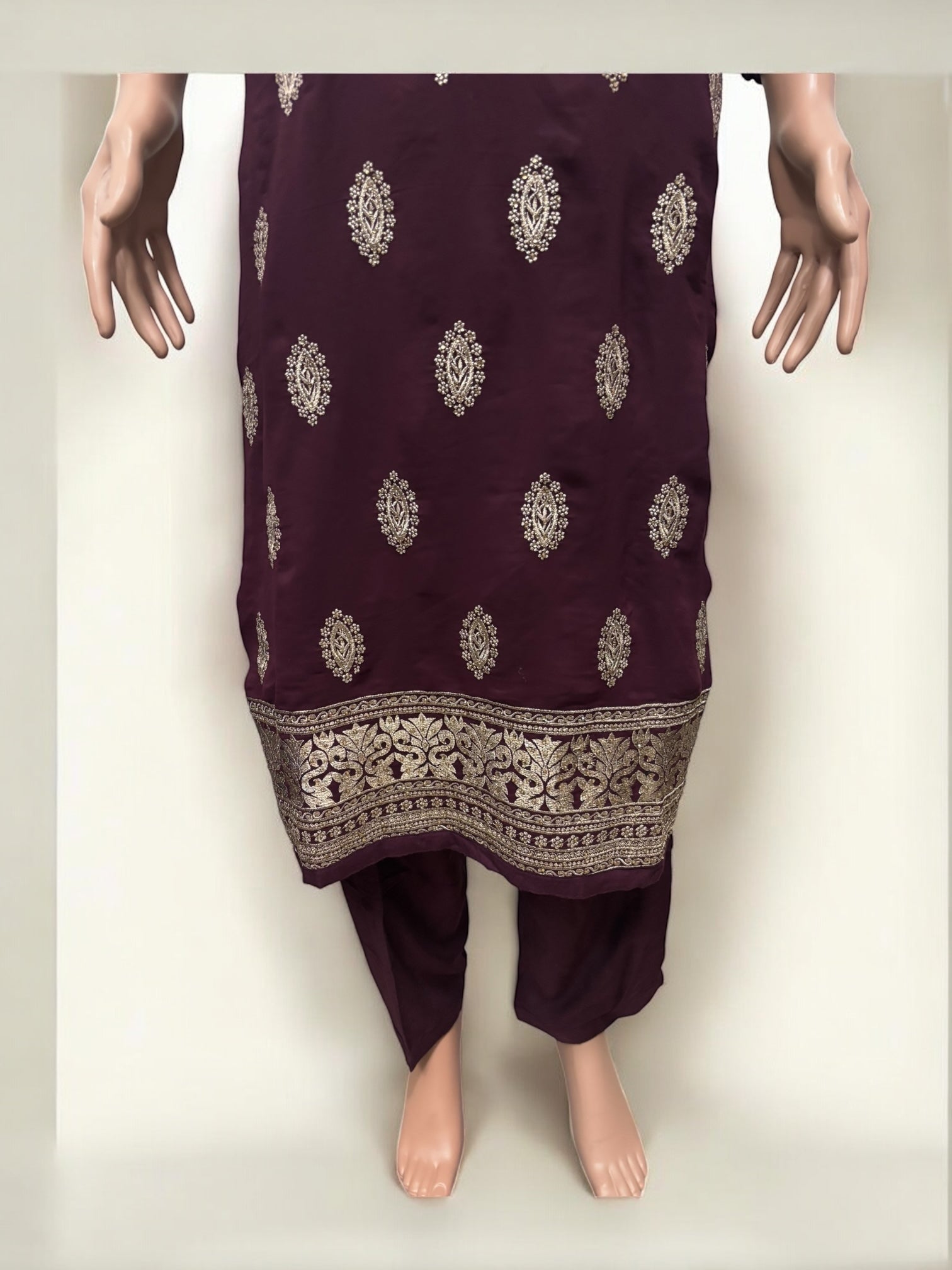 Traditional Salwar Kameez set by Saree Ghor Charlotte, ethnic women’s wear with intricate design and vibrant fabric.