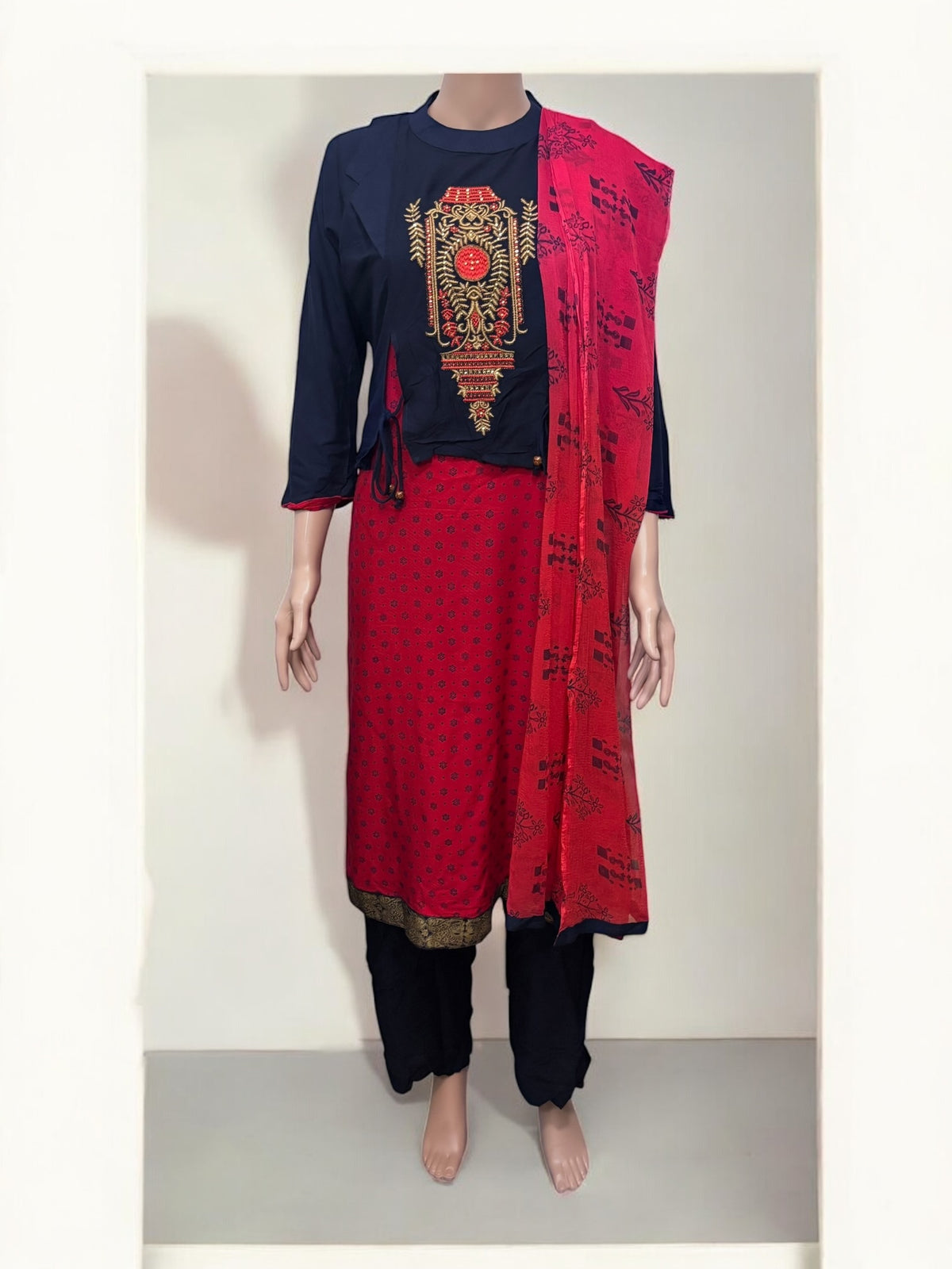 Traditional Saree Ghor Charlotte Salwar Kameez set for women featuring intricate ethnic embroidery and vibrant fabric details.