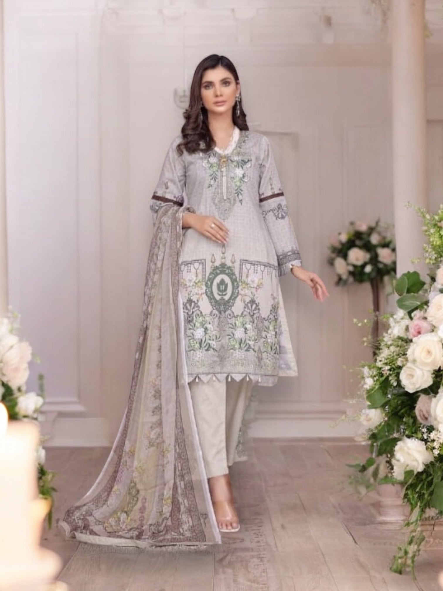 Traditional Soni Brand Pakistani Salwar Kameez for women, featuring vibrant ethnic wear with intricate embroidery and colorful fabric.