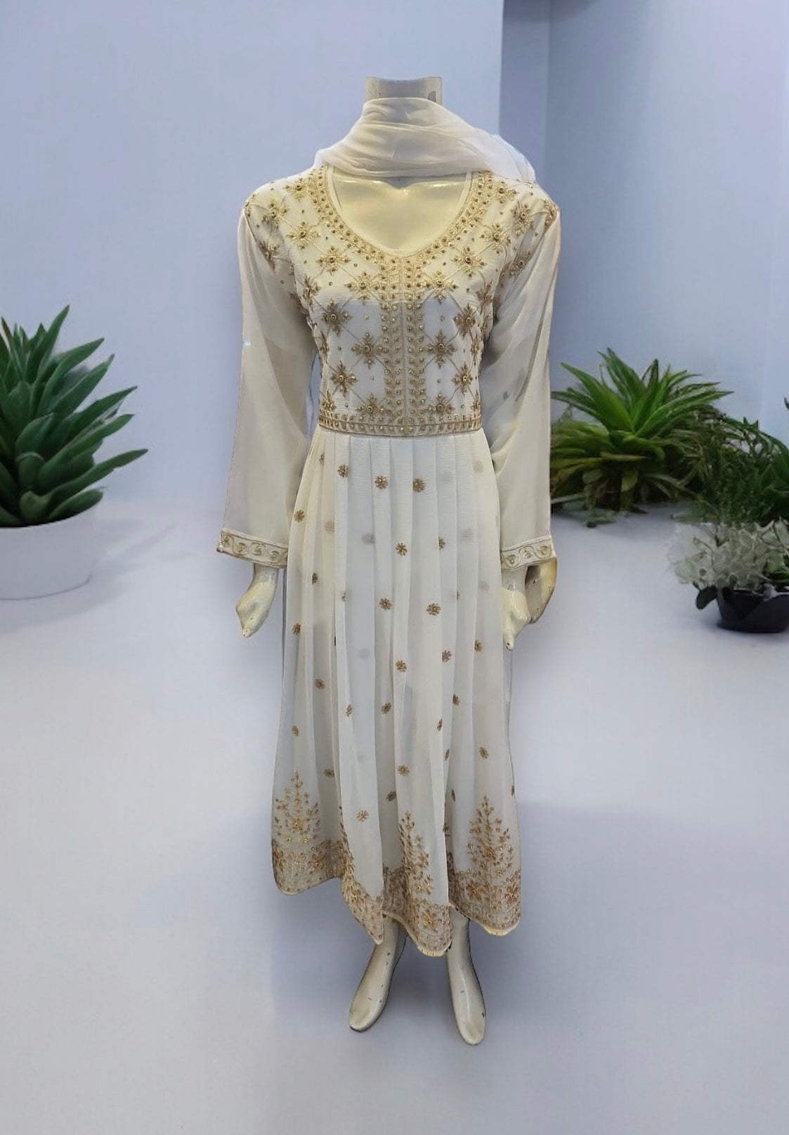 White designer Salwar Kameez by Saree Ghor Charlotte, elegant ethnic party wear dress for women with intricate detailing.