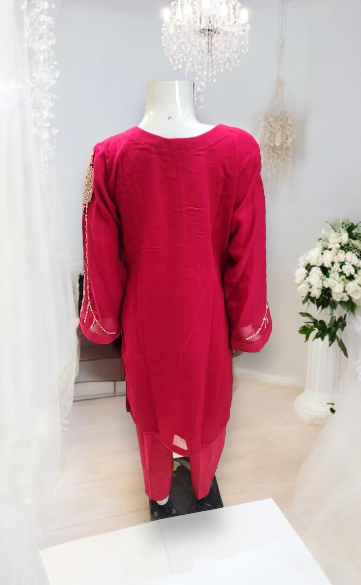 Girls traditional designer Salwar Kameez suit by Saree Ghor Charlotte, featuring ethnic wear with vibrant fabric and intricate embroidery.