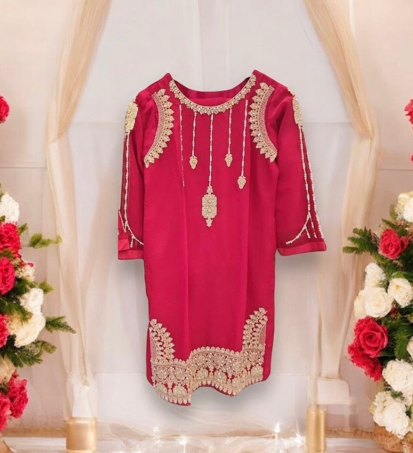Girls traditional designer Salwar Kameez suit by Saree Ghor Charlotte, showcasing vibrant ethnic wear with intricate patterns.