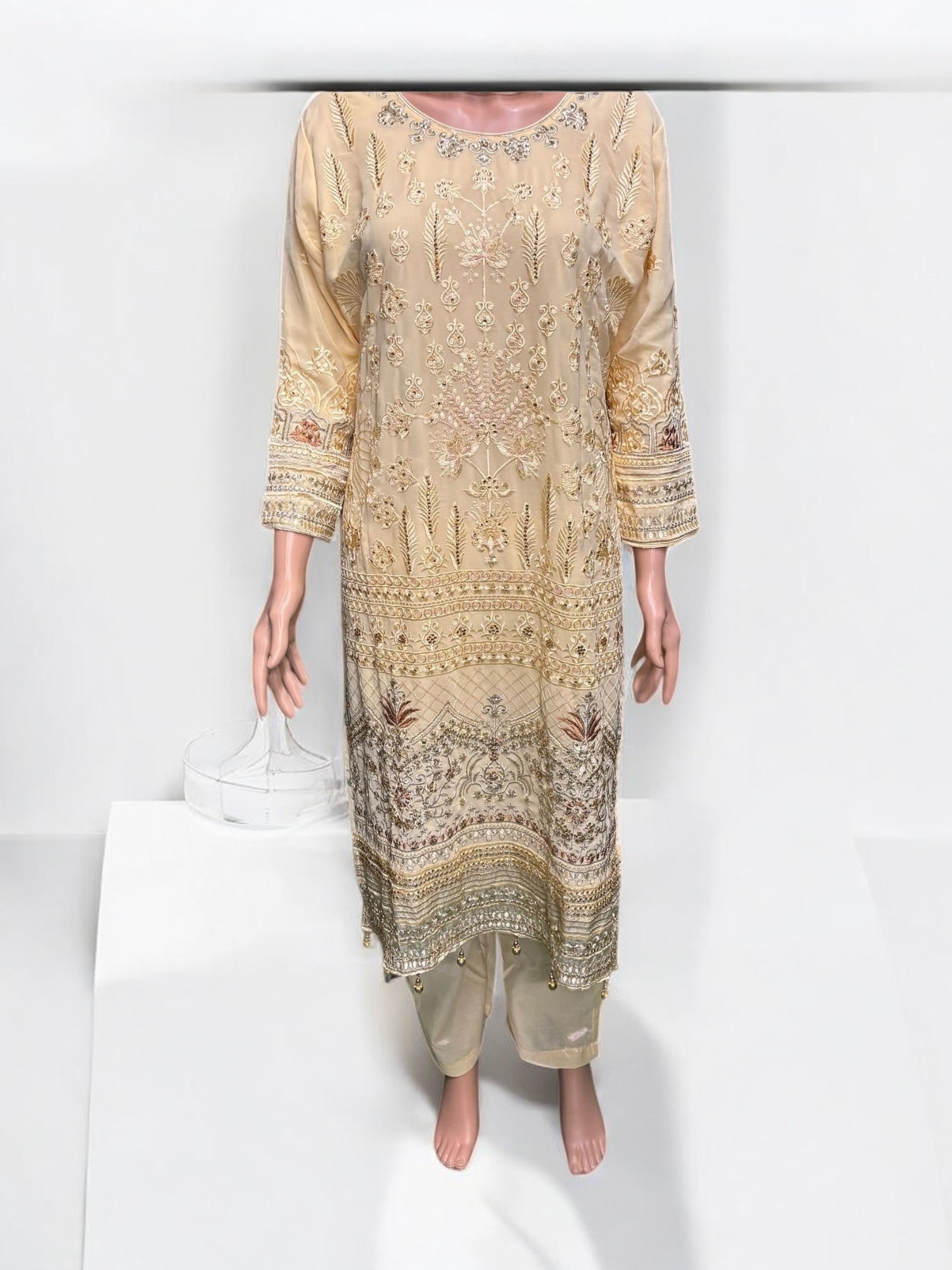 Golden color georgette salwar kameez set with embroidery work, cultural ethnic wear for women by Saree Ghor Charlotte.