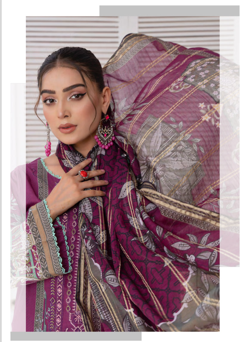 Traditional Pakistani Salwar Kameez suit in vibrant fabric, ethnic wear for women by Saree Ghor Charlotte showing intricate details.