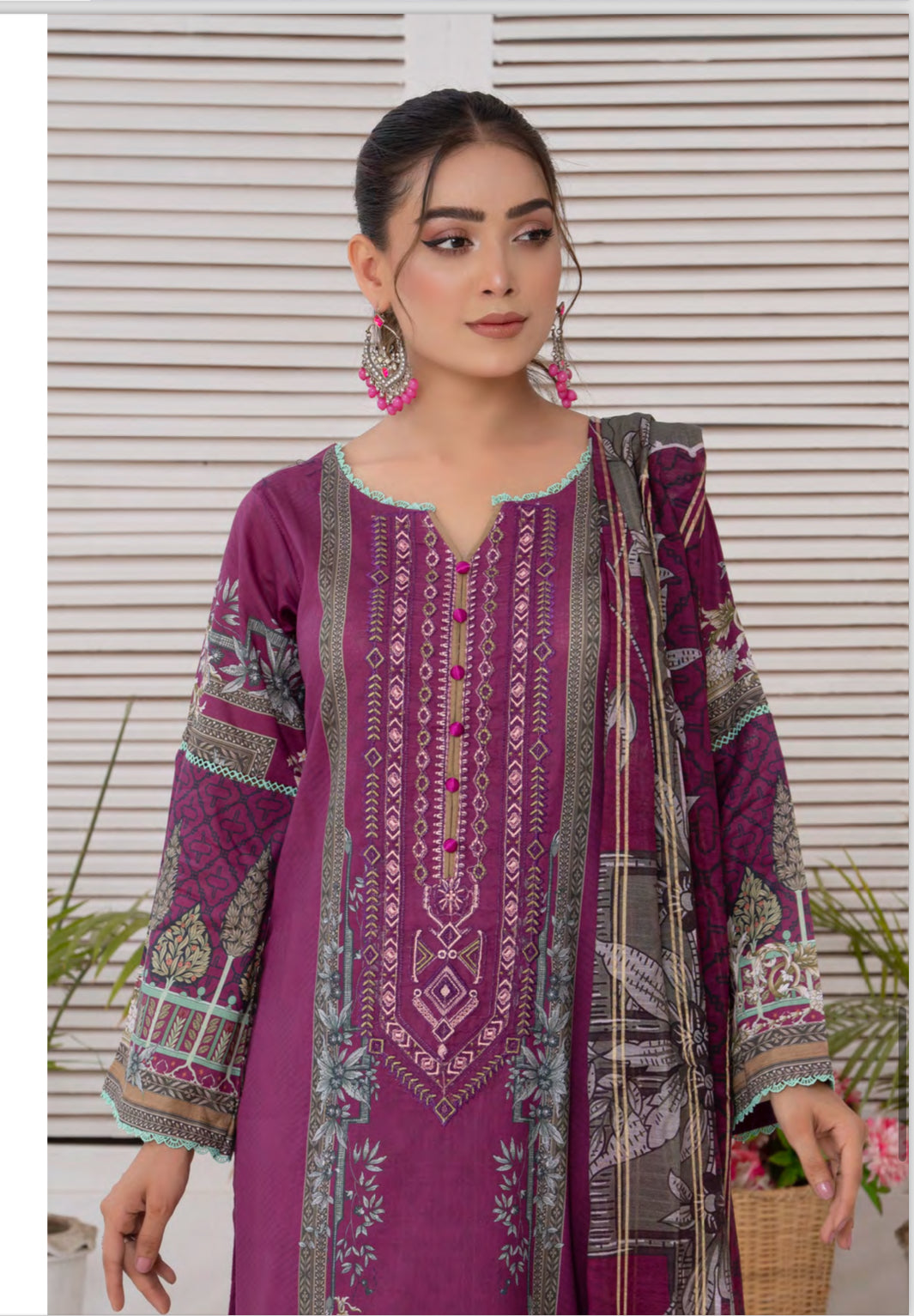 Traditional Pakistani Salwar Kameez suit by Saree Ghor Charlotte, ethnic wear for women, detailed fabric and vibrant colors.