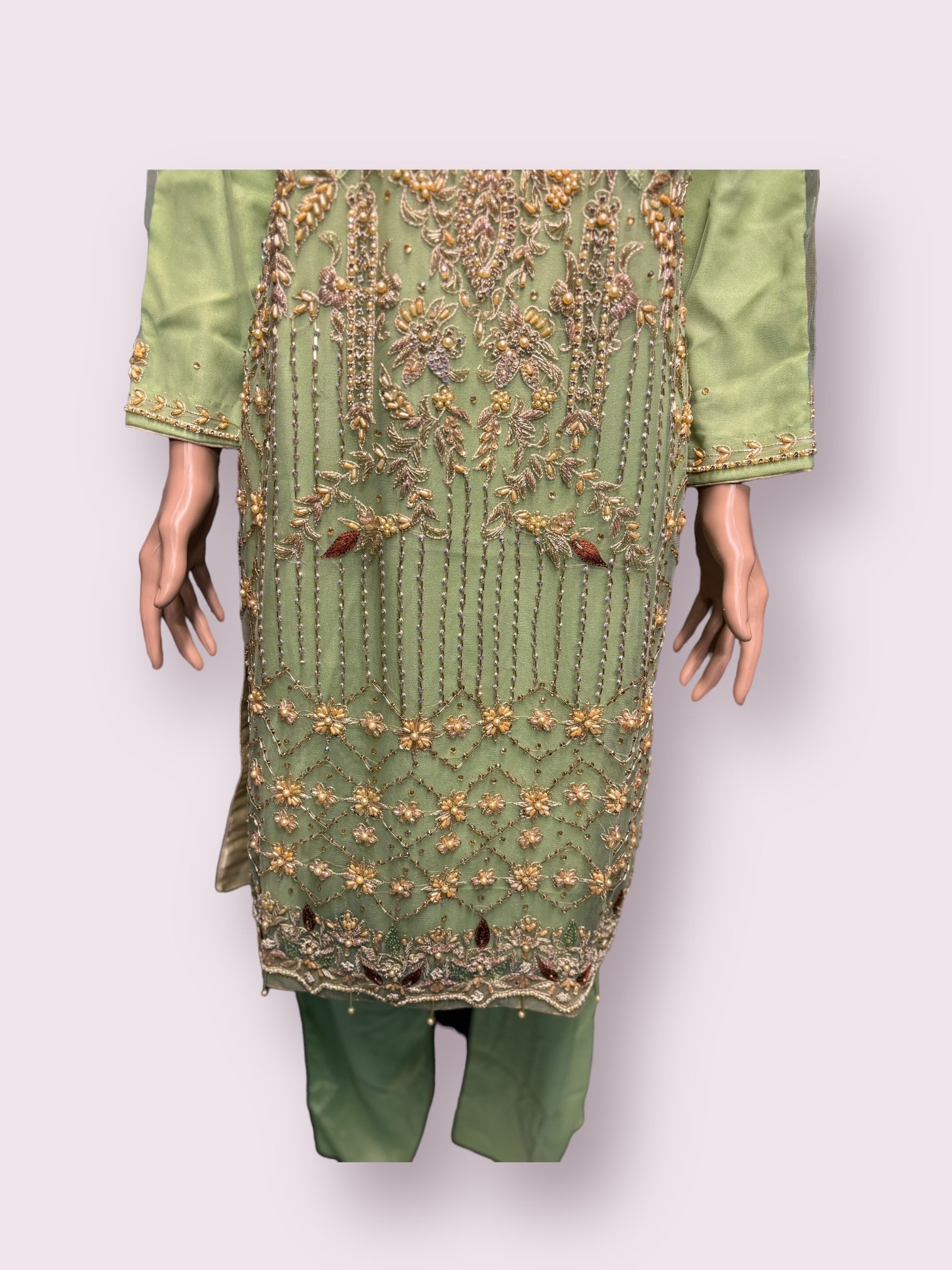 Elegant handwork designer salwar kameez by Saree Ghor Charlotte, featuring intricate embroidery and traditional styling.