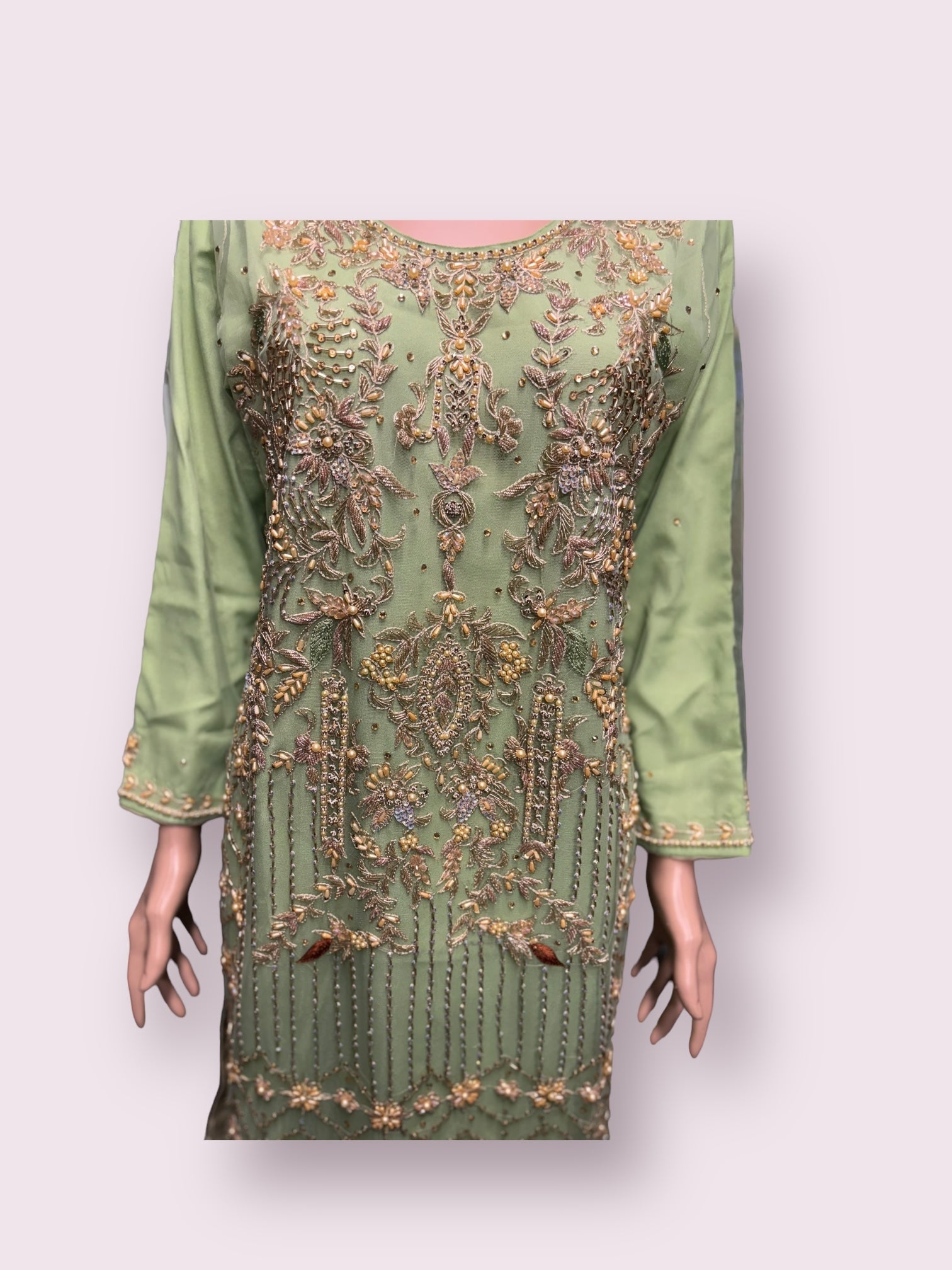 Elegant handwork designer salwar kameez by Saree Ghor Charlotte featuring intricate embroidery and vibrant fabric details.