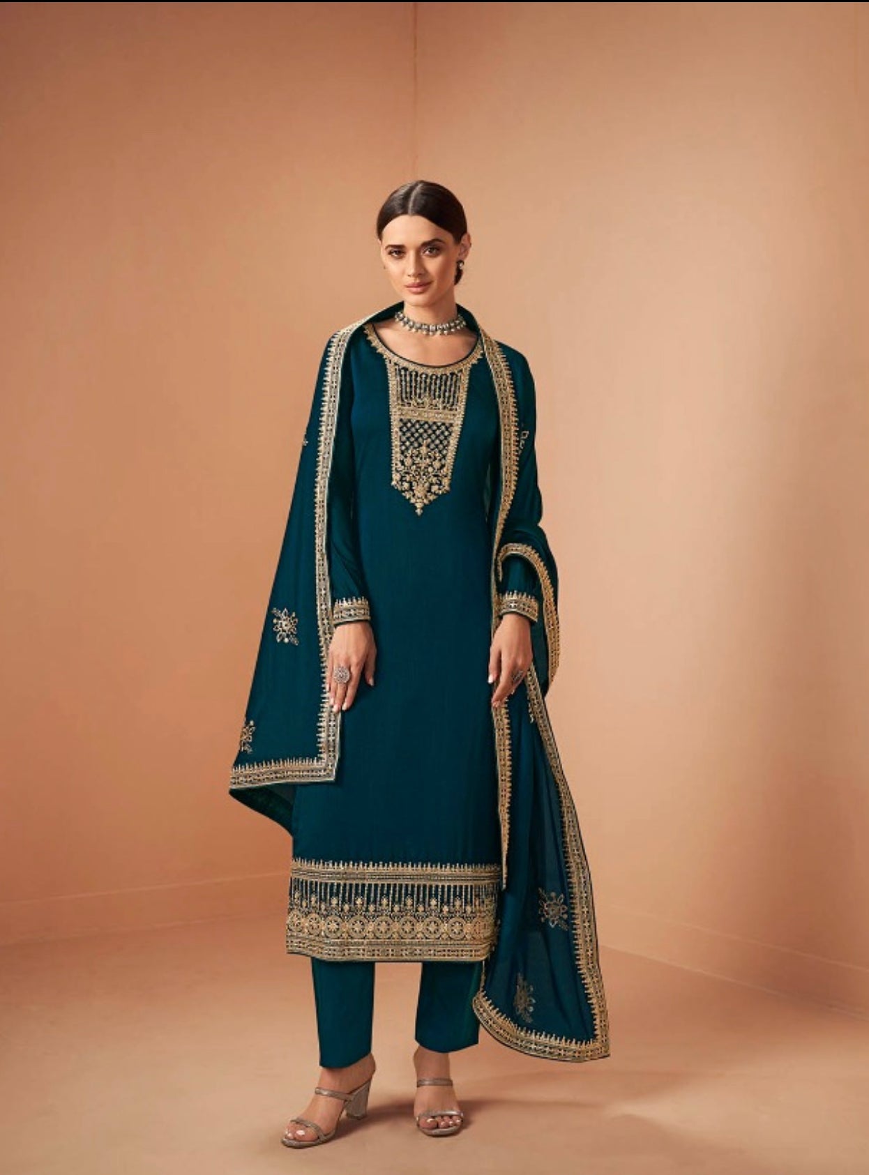 Traditional blooming silk Georgette Salwar Kameez for women, showcasing vibrant ethnic wear with intricate design details.