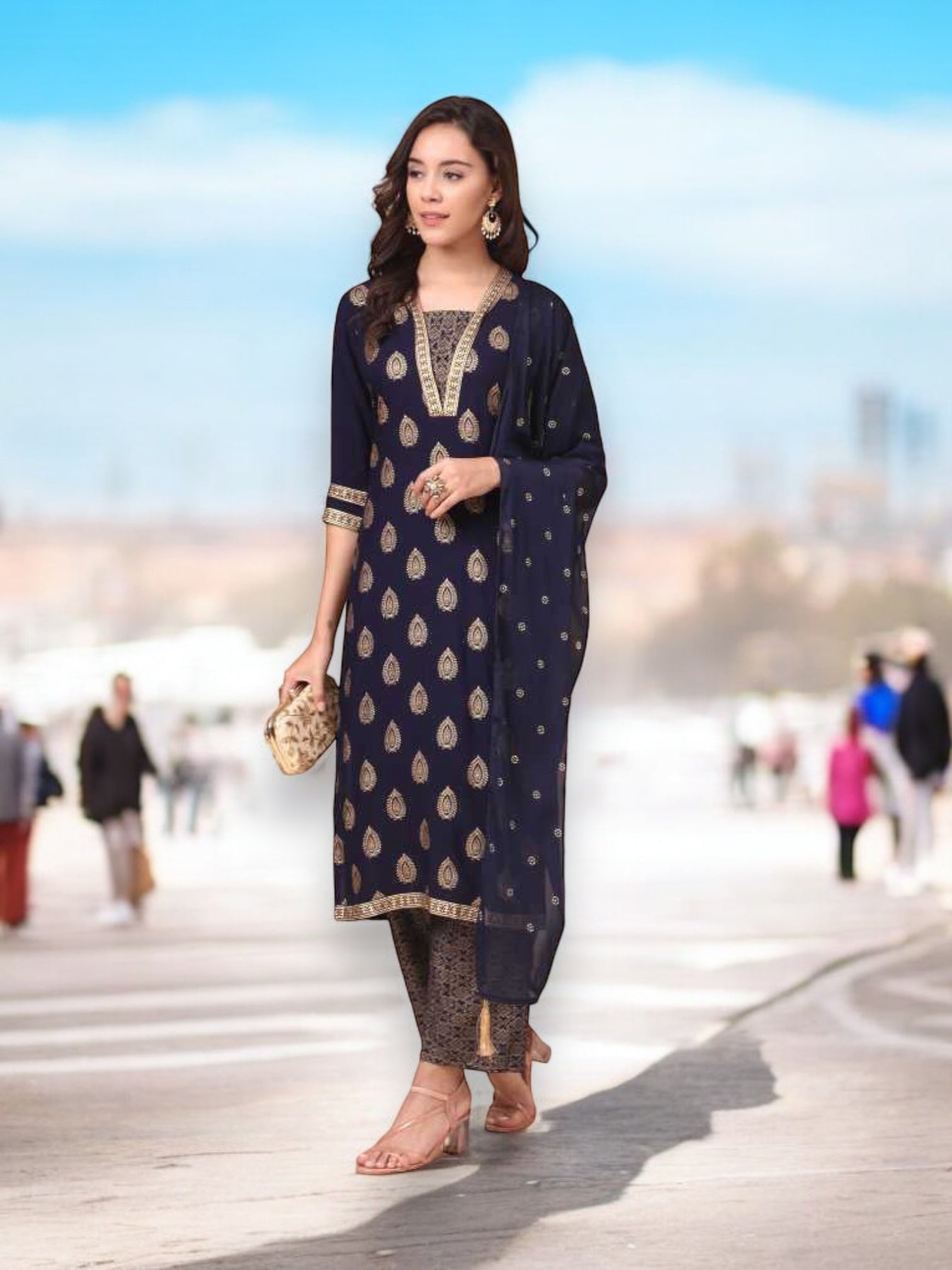 Traditional Saree Ghor Charlotte salwar kameez set with kurti, pants, and dupatta, worn by a woman in ethnic wear.