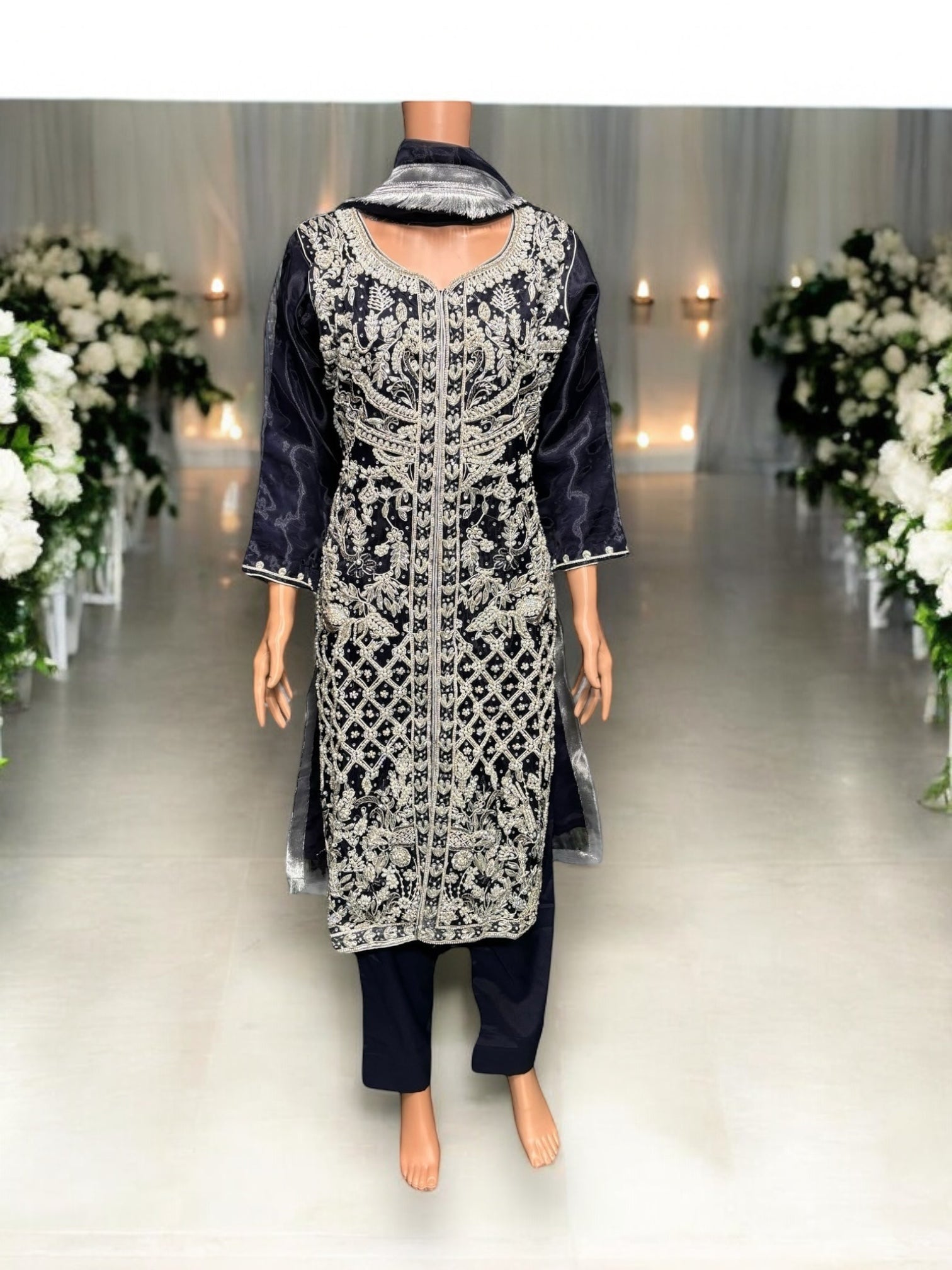Elegant designer Salwar Kameez ensemble by Saree Ghor Charlotte featuring intricate handwork and vibrant ethnic wear for women.