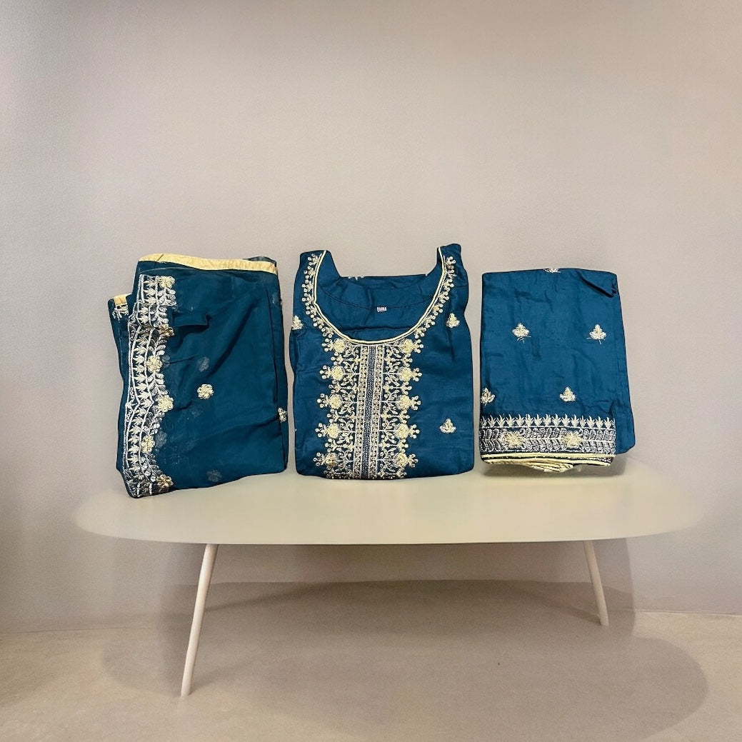Stylish linen Aura party wear salwar kameez by Saree Ghor Charlotte featuring intricate embroidery and elegant design.