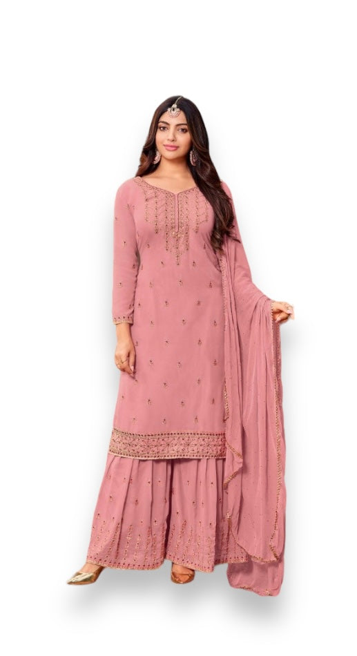 Traditional designer Salwar Kameez by Saree Ghor Charlotte, elegant ethnic wear for women, featuring intricate patterns and vibrant colors.