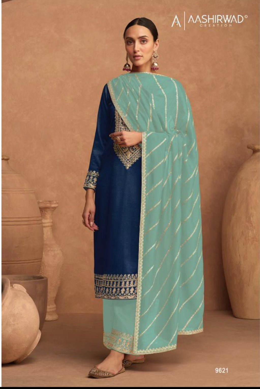 Elegant traditional silk salwar kameez for women by Saree Ghor Charlotte, featuring intricate design and vibrant cultural details.