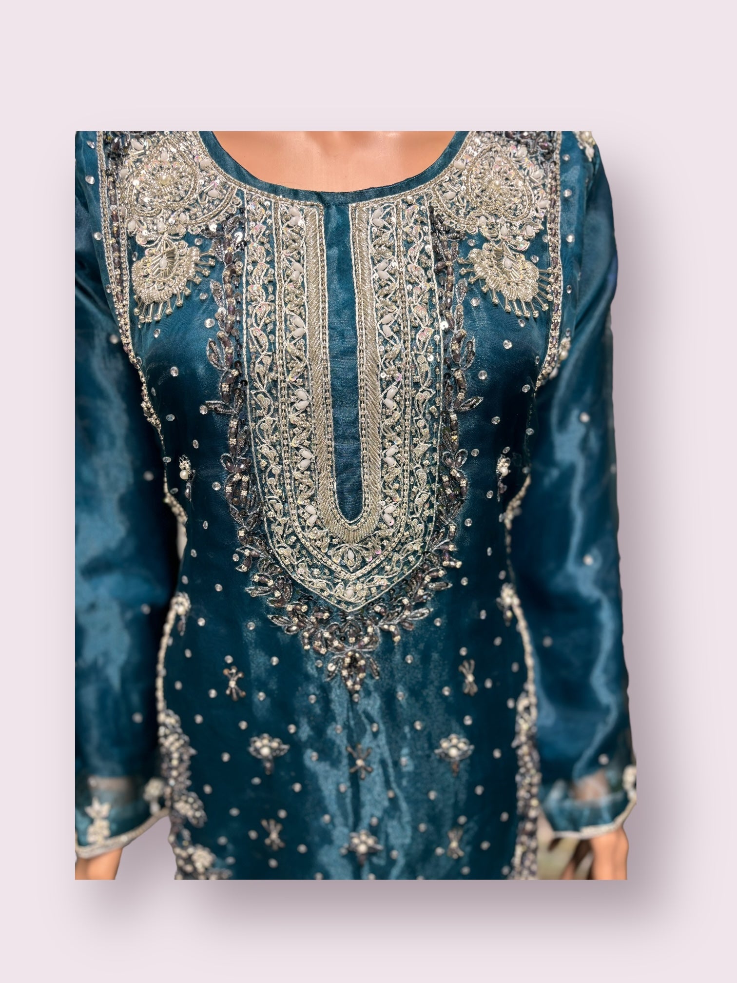 Traditional handwork designer Salwar Kameez ensemble by Saree Ghor Charlotte, featuring intricate embroidery and vibrant ethnic style.