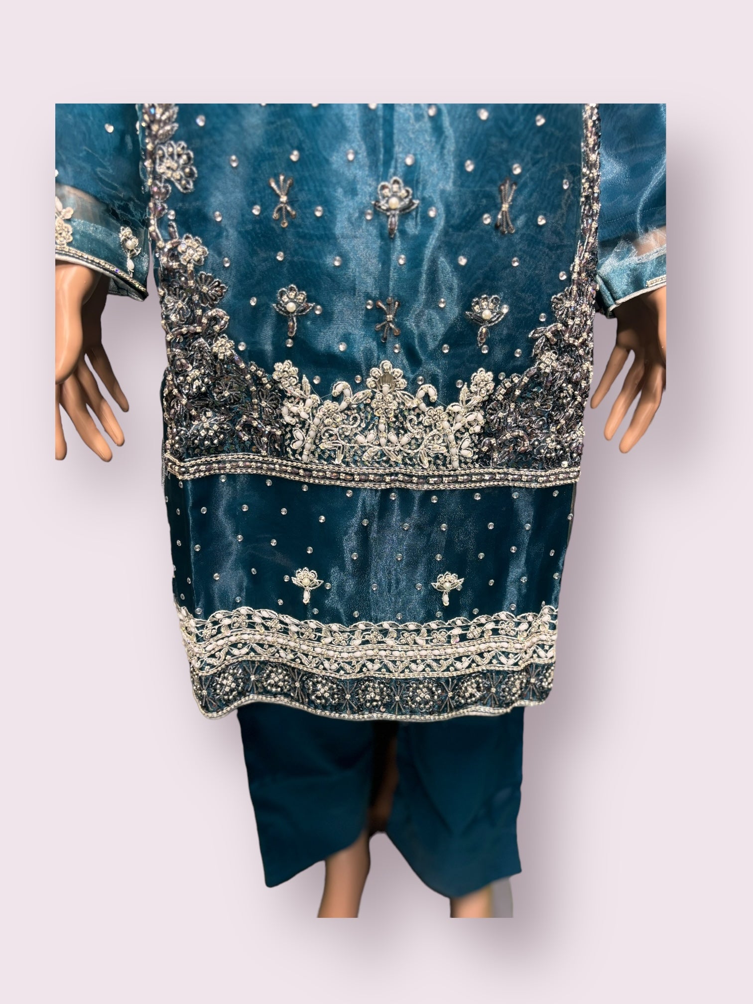 Traditional handwork designer Salwar Kameez ensemble by Saree Ghor Charlotte, featuring intricate embroidery and vibrant ethnic fabric.