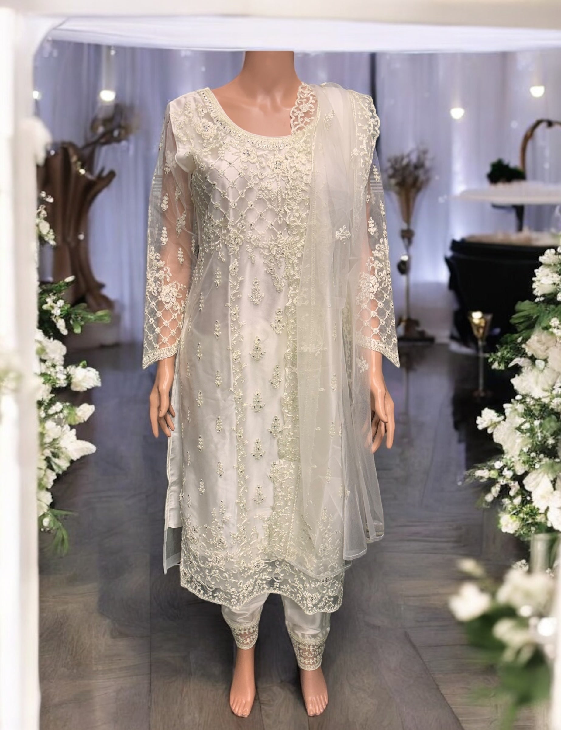 Traditional off-white designer salwar kameez by Saree Ghor Charlotte, ethnic wear for women with intricate embroidery and classic style.