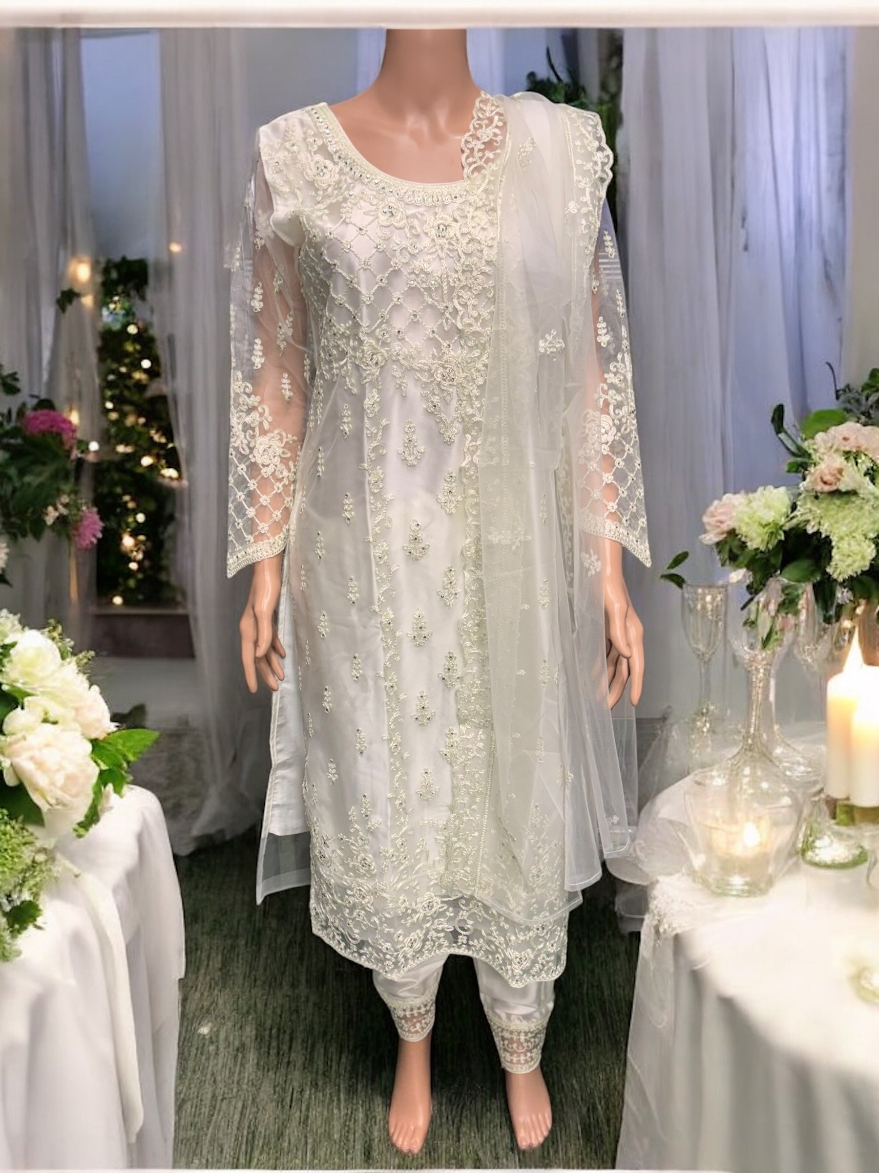 Traditional off-white designer Salwar Kameez by Saree Ghor Charlotte, elegant ethnic wear for women with intricate detailing.