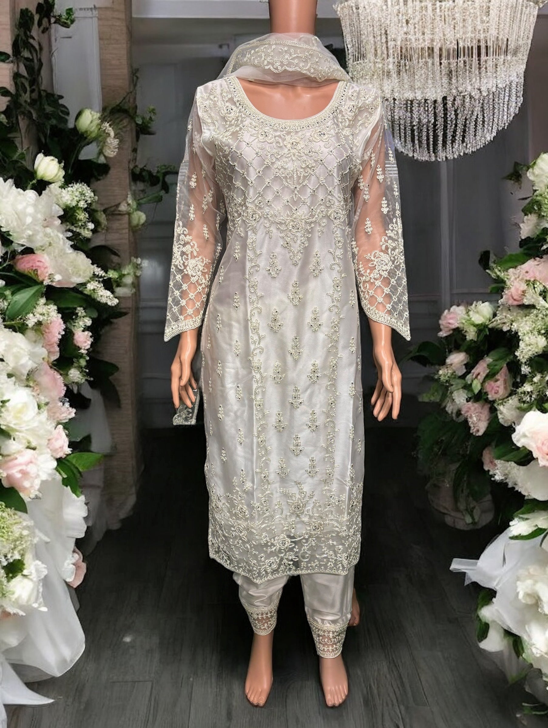 Traditional off-white designer salwar kameez by Saree Ghor Charlotte, elegant ethnic wear for women with intricate details.