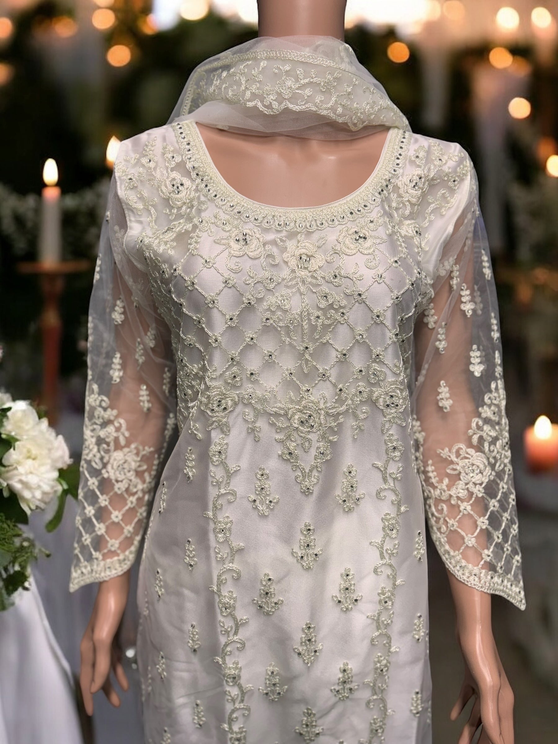 Traditional off-white designer Salwar Kameez by Saree Ghor Charlotte, elegant ethnic wear for women with intricate detailing.