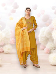 Traditional silk salwar kameez for women by Saree Ghor Charlotte, showcasing intricate embroidery and vibrant fabric details.
