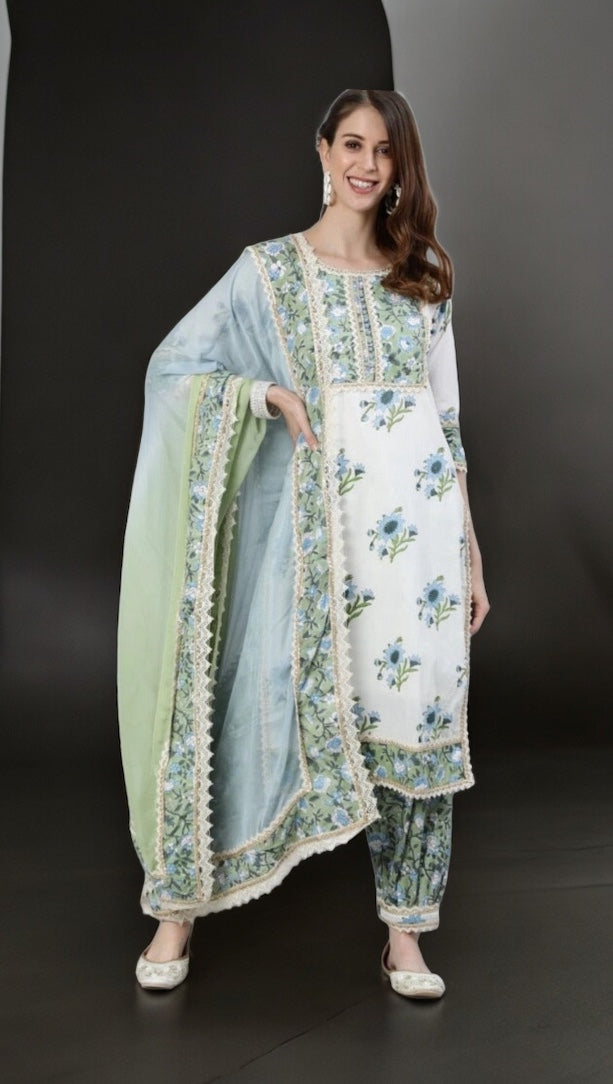 Traditional white embroidery cotton salwar kameez by Saree Ghor Charlotte, featuring intricate embroidery and ethnic wear for women.