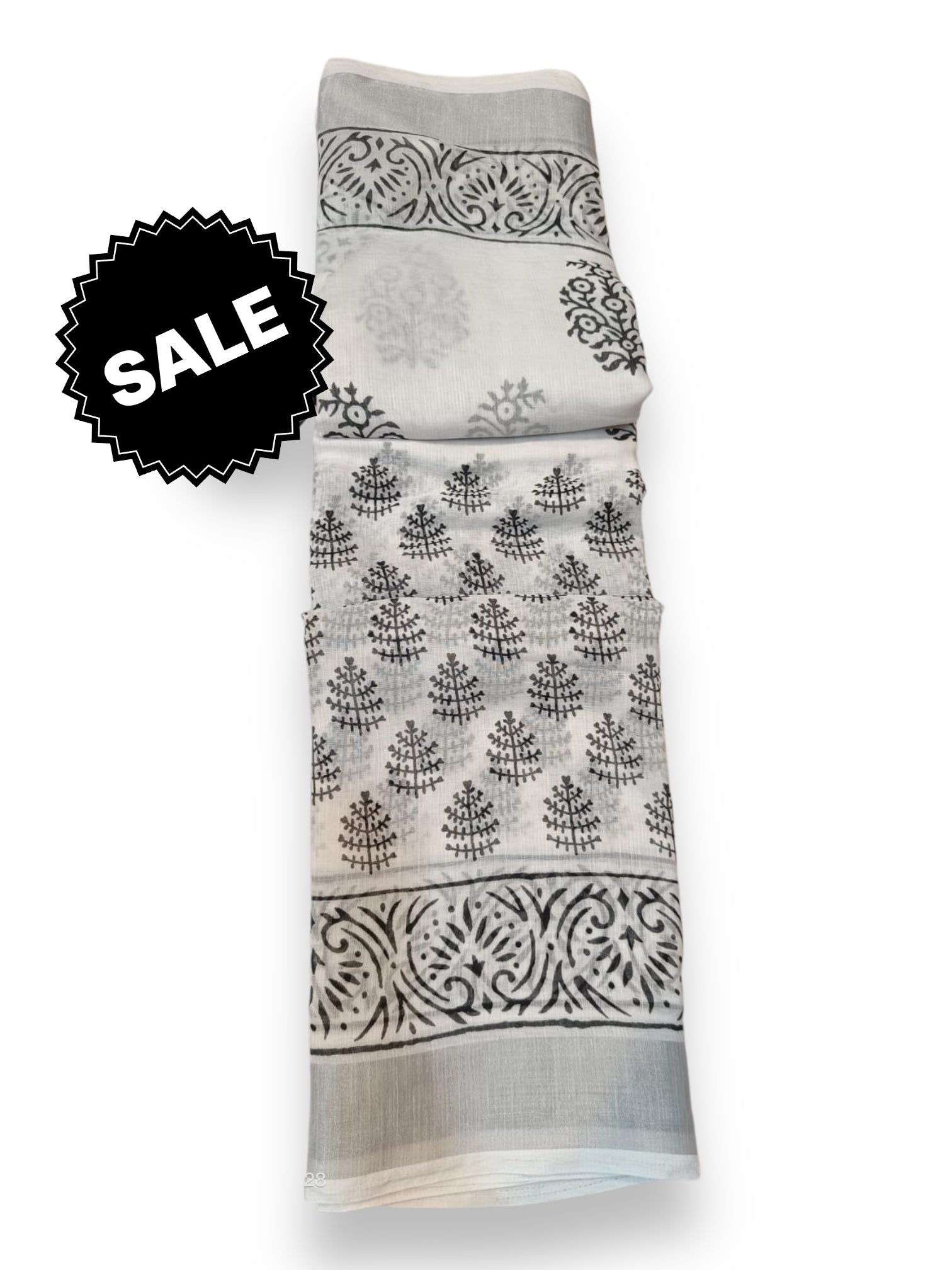 Traditional soft linen print saree by Saree Ghor Charlotte, featuring intricate ethnic patterns and elegant drape for women.