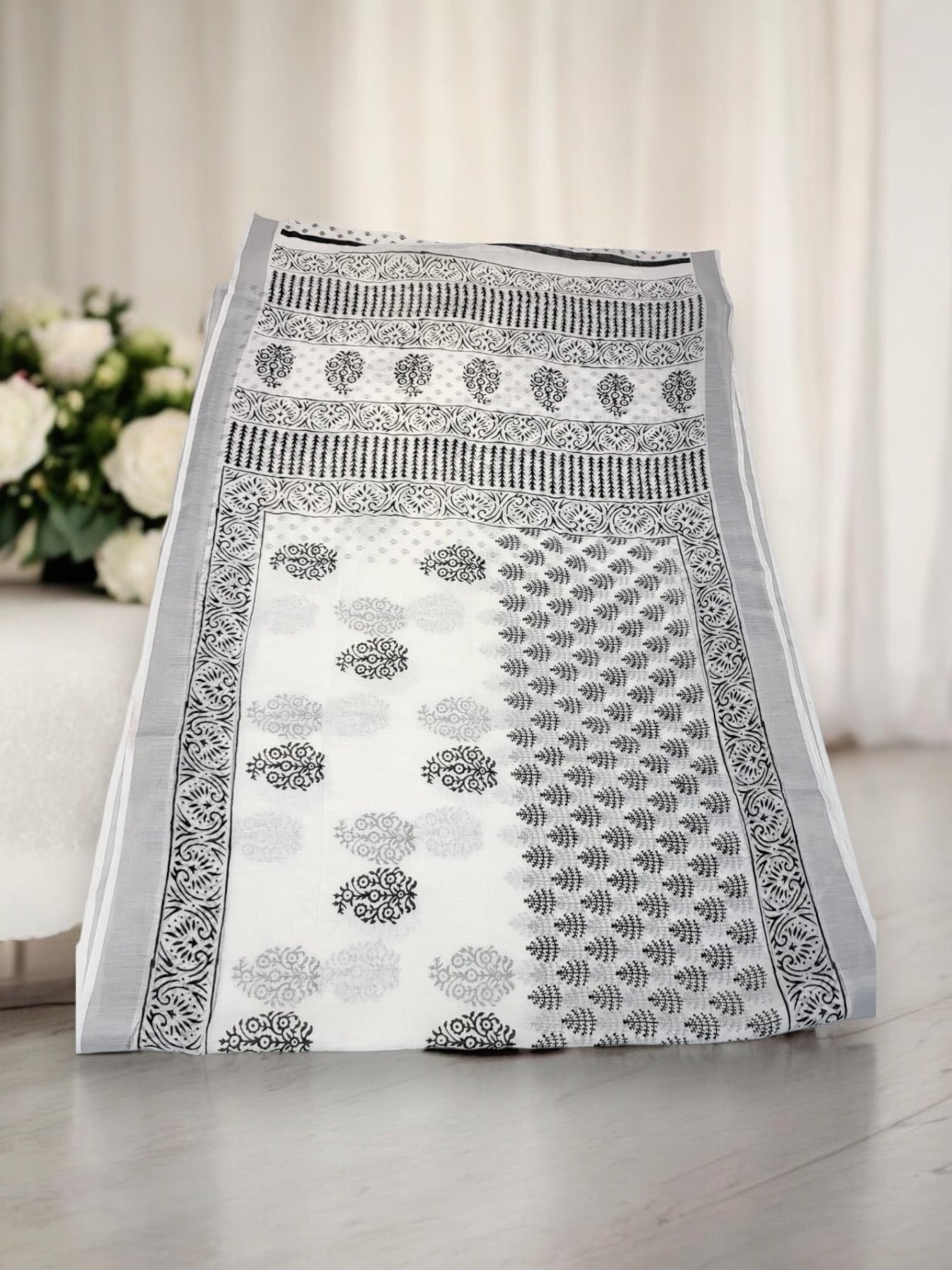 Traditional soft linen print saree by Saree Ghor Charlotte, showcasing vibrant ethnic design for women's cultural wear.