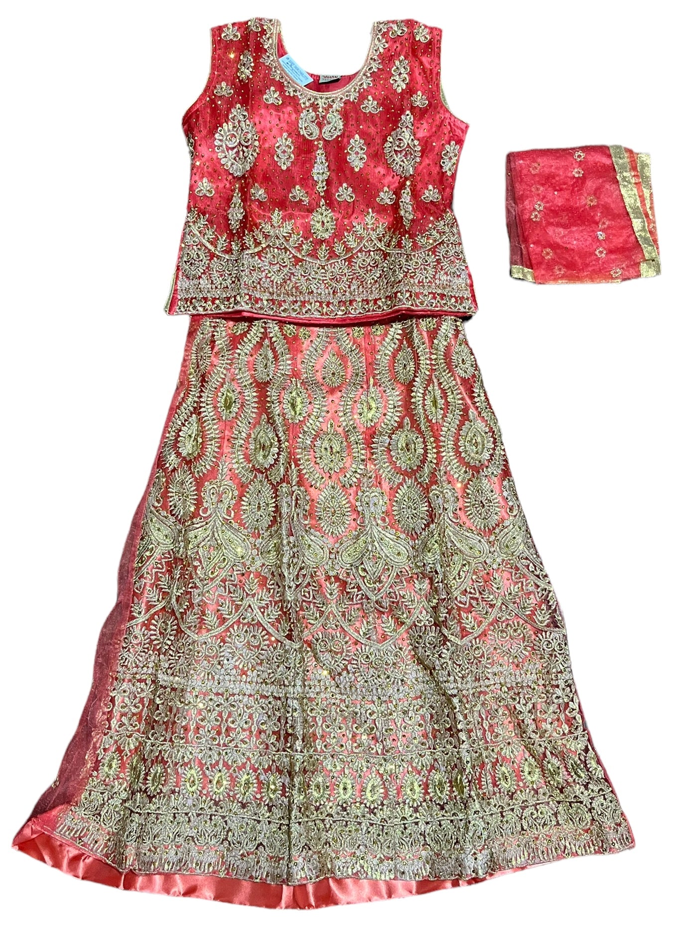 Traditional girls' Lehenga Choli set in vibrant colors, worn by a young girl, featuring intricate ethnic embroidery and a flowing skirt.