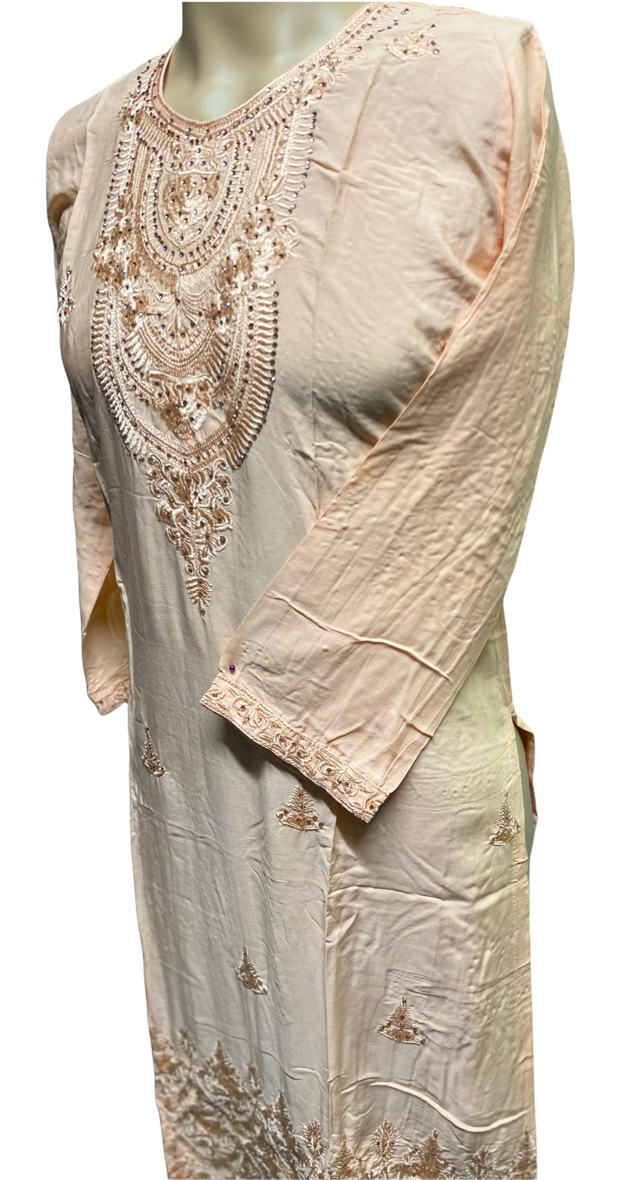 Traditional cotton long sleeve Salwar Kameez suit with intricate embroidery, worn by women for cultural and ethnic occasions.