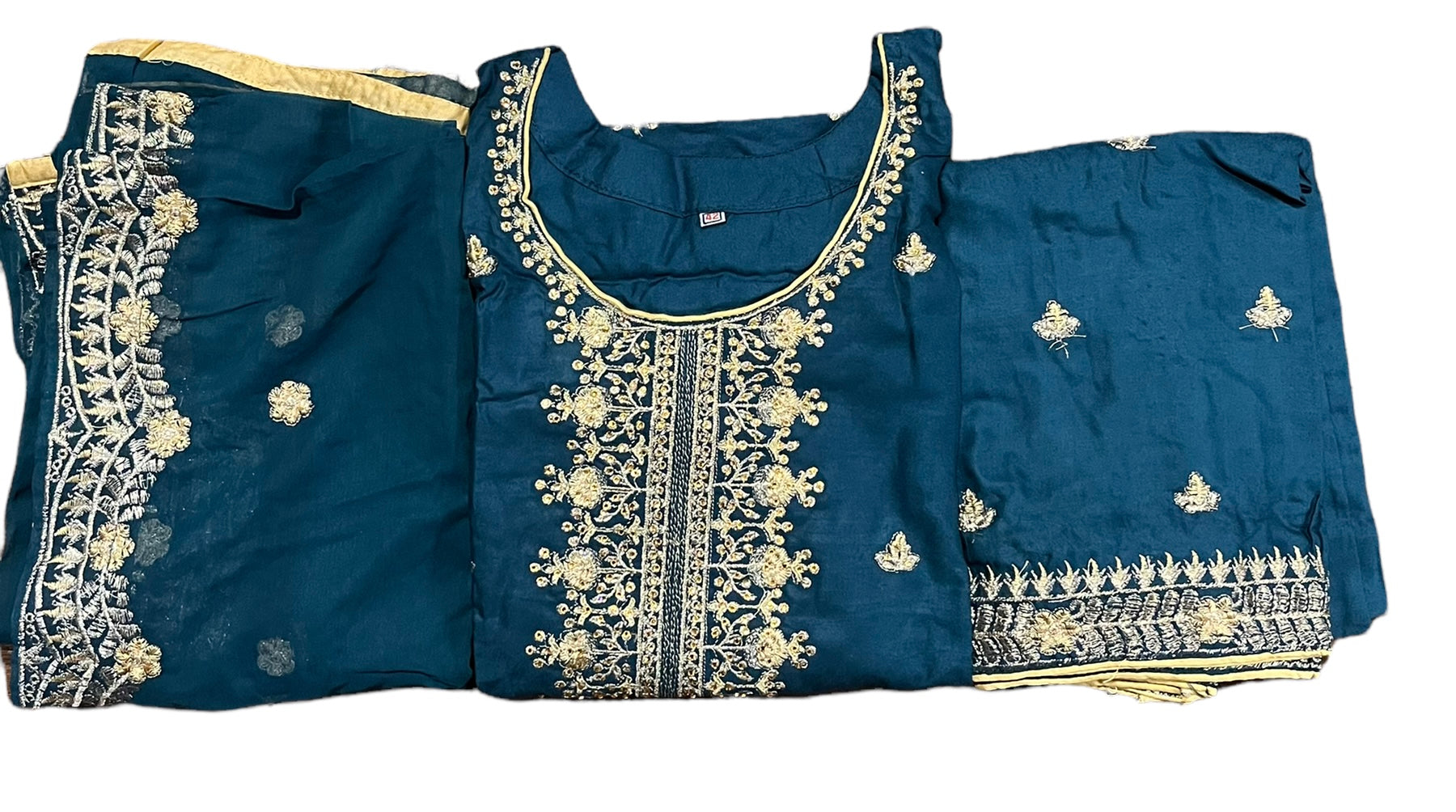 Stylish linen Aura party wear Salwar Kameez by Saree Ghor Charlotte with intricate embroidery and elegant design.