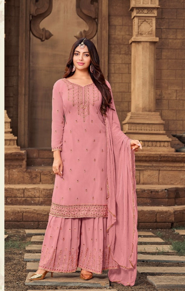 Traditional Designer Salwar Kameez by Saree Ghor Charlotte, vibrant ethnic wear for women with intricate patterns and elegant fabric.