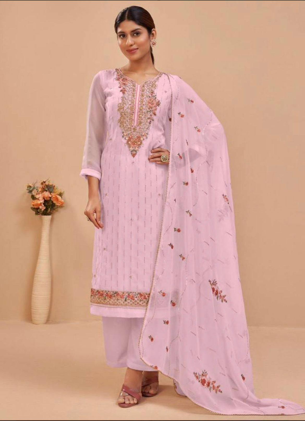 Traditional pink georgette salwar suit for women, heavy festive wear by Saree Ghor Charlotte, with intricate ethnic embroidery.